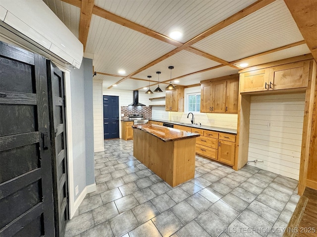 kitchen with a kitchen island, wall chimney exhaust hood, a sink, backsplash, and hanging light fixtures