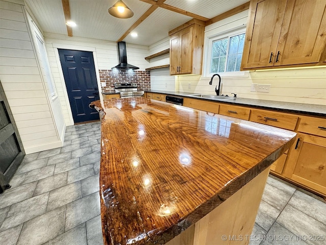 kitchen with a sink, butcher block countertops, open shelves, and wall chimney exhaust hood