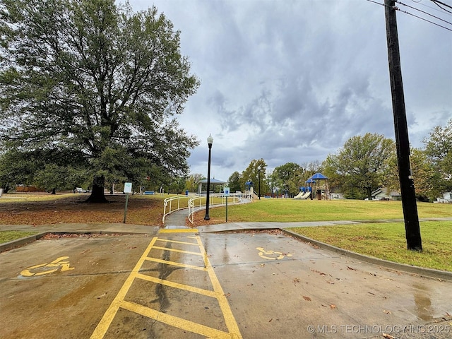view of road featuring street lighting and curbs