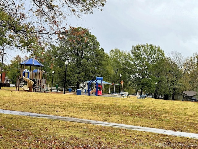 communal playground featuring a lawn