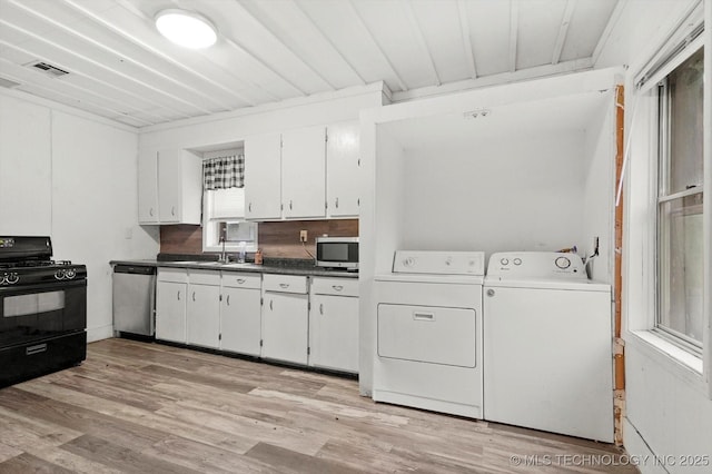 kitchen with visible vents, white cabinets, separate washer and dryer, light wood finished floors, and stainless steel appliances