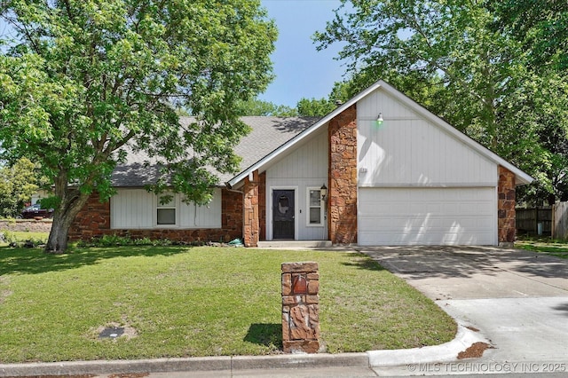 view of front of property with roof with shingles, a front yard, concrete driveway, an attached garage, and stone siding