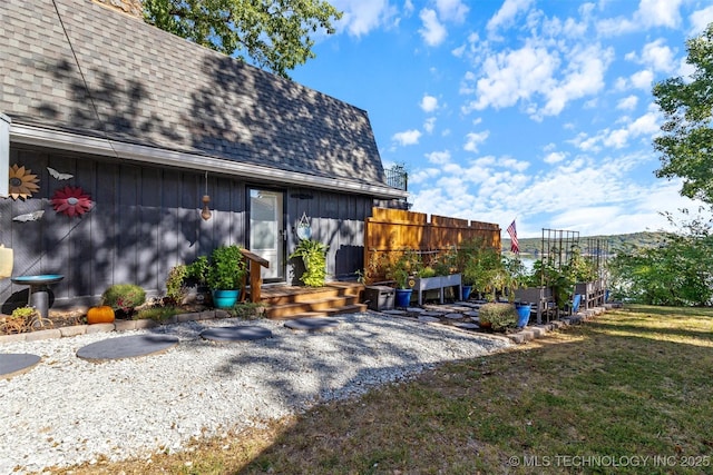 24591 S 613th Rd, Grove, OK 74344 - back of house with a yard, fence, and roof with shingles