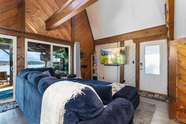 24591 S 613th Rd, Grove, OK 74344 - living area with plenty of natural light, wood finished floors, and wooden walls