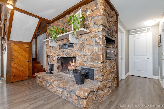 24591 S 613th Rd, Grove, OK 74344 - living room with visible vents, wood finished floors, baseboards, a stone fireplace, and stairway