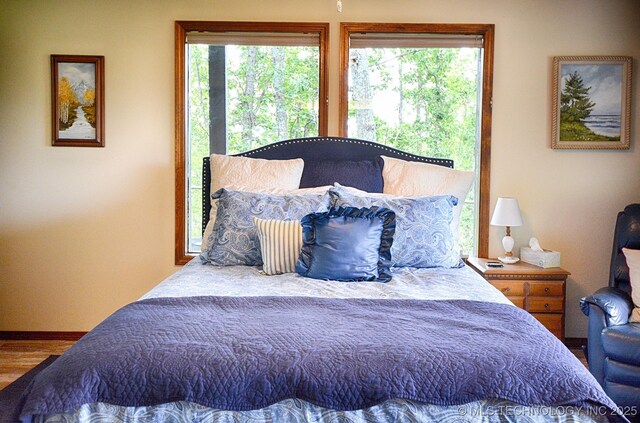 95884 Rock Cliff Rd, Gore, OK 74435 - bedroom featuring baseboards and wood finished floors