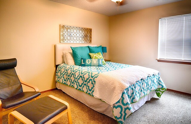 95884 Rock Cliff Rd, Gore, OK 74435 - carpeted bedroom with baseboards and ceiling fan