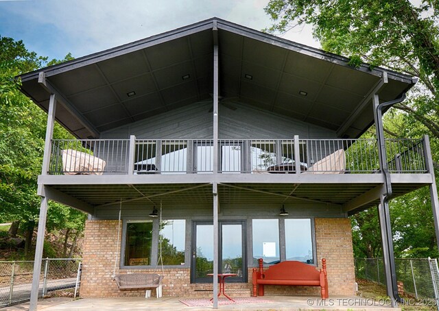 95884 Rock Cliff Rd, Gore, OK 74435 - rear view of property featuring fence and brick siding