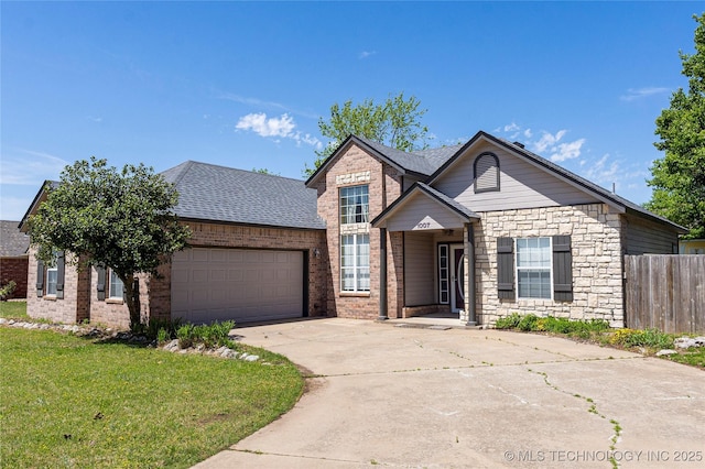 view of front facade featuring an attached garage, fence, brick siding, and concrete driveway