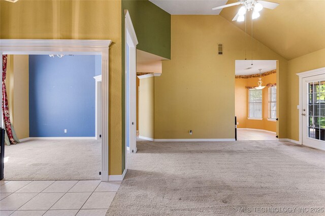 1007 W Beech St, Skiatook, OK 74070 - unfurnished living room with ceiling fan, high vaulted ceiling, carpet, baseboards, and visible vents