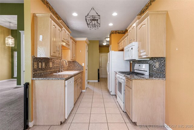 1007 W Beech St, Skiatook, OK 74070 - kitchen with white appliances, backsplash, a sink, and light brown cabinets