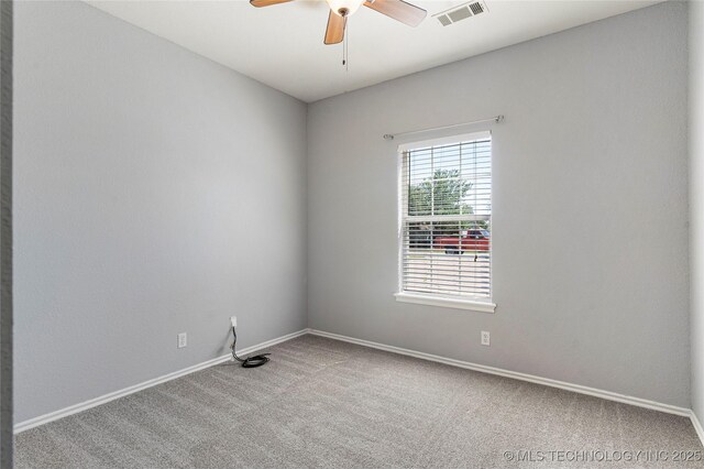 1007 W Beech St, Skiatook, OK 74070 - unfurnished room with visible vents, a ceiling fan, carpet, and baseboards