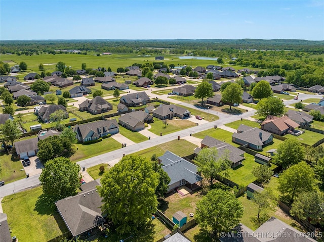 aerial view featuring a water view and a residential view