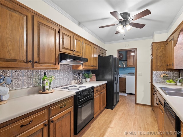 kitchen with brown cabinets, ceiling fan, decorative backsplash, under cabinet range hood, and black appliances