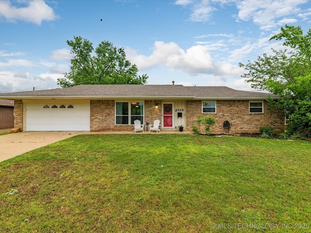 ranch-style home featuring an attached garage, concrete driveway, a front yard, and brick siding