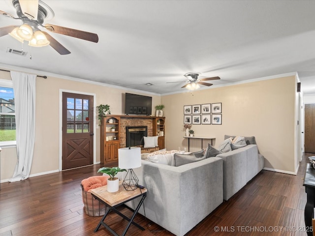 living area featuring visible vents, a ceiling fan, dark wood finished floors, and a fireplace