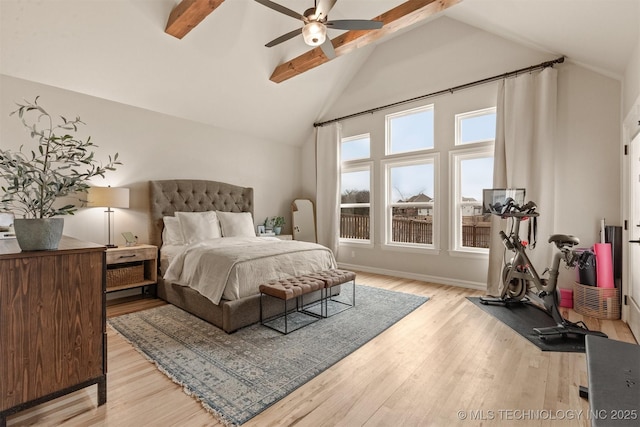 bedroom with high vaulted ceiling, a ceiling fan, baseboards, light wood-type flooring, and beamed ceiling