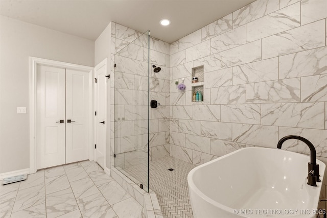 full bath with a shower stall, a sink, marble finish floor, a soaking tub, and recessed lighting