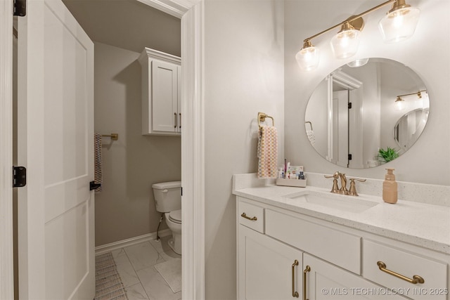 bathroom featuring baseboards, marble finish floor, toilet, and vanity