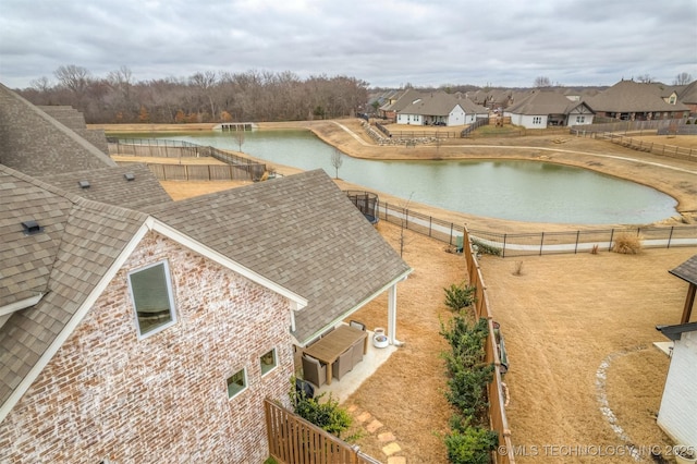 aerial view with a residential view and a water view
