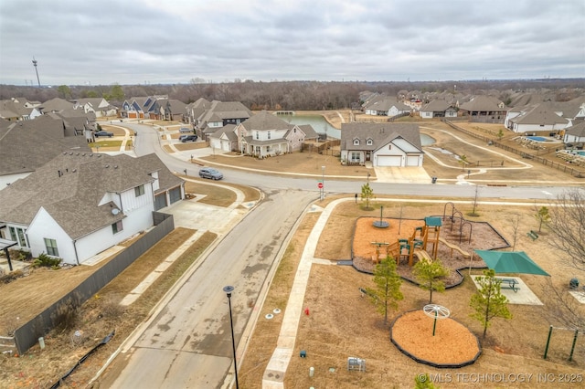 birds eye view of property with a residential view