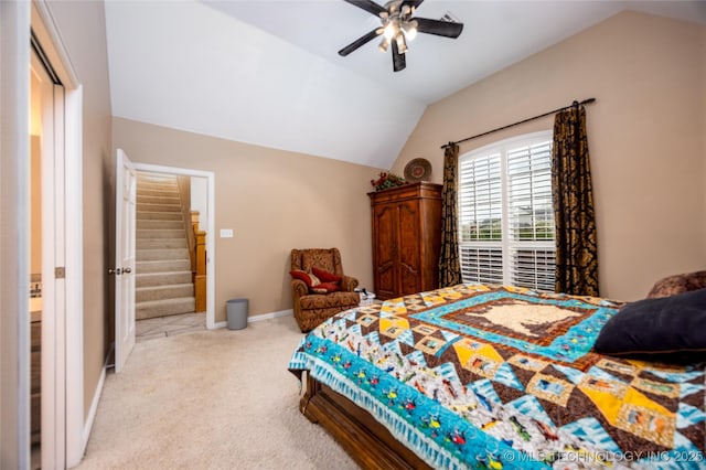 carpeted bedroom with a ceiling fan, baseboards, and vaulted ceiling