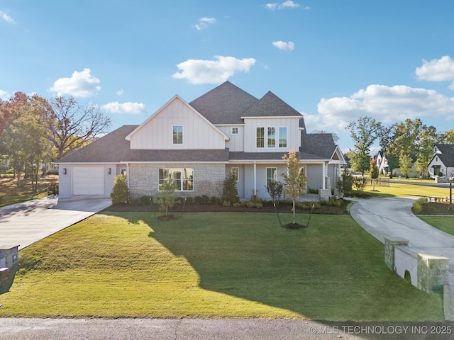 view of front facade featuring concrete driveway, an attached garage, board and batten siding, and a front yard