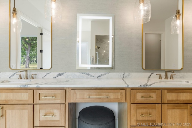 bathroom featuring double vanity and a sink