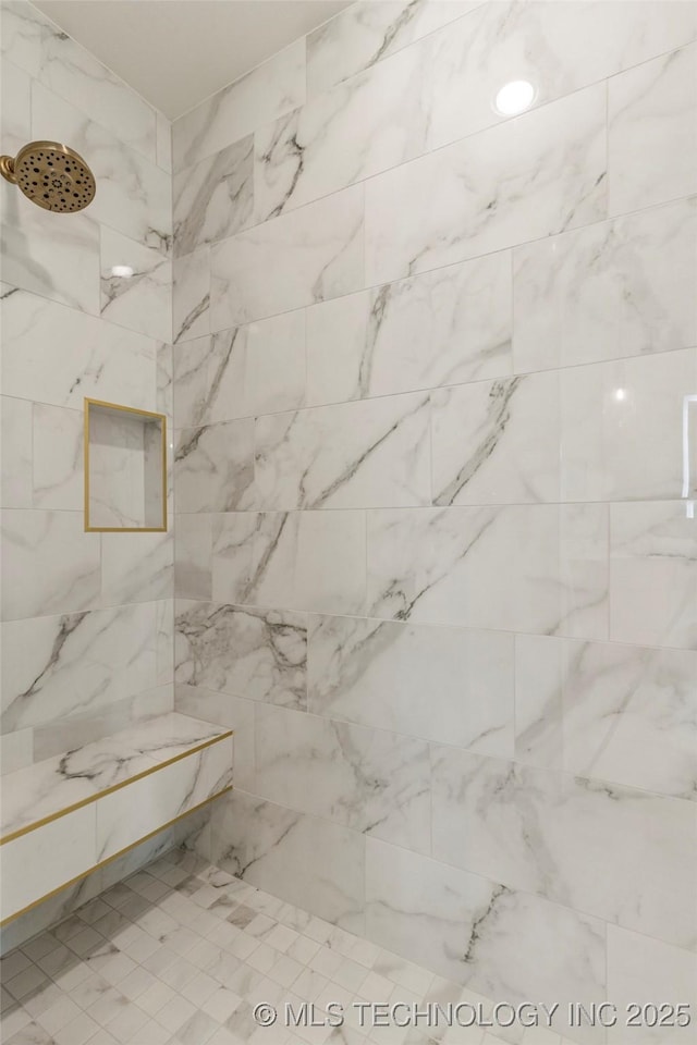 bathroom featuring tiled shower