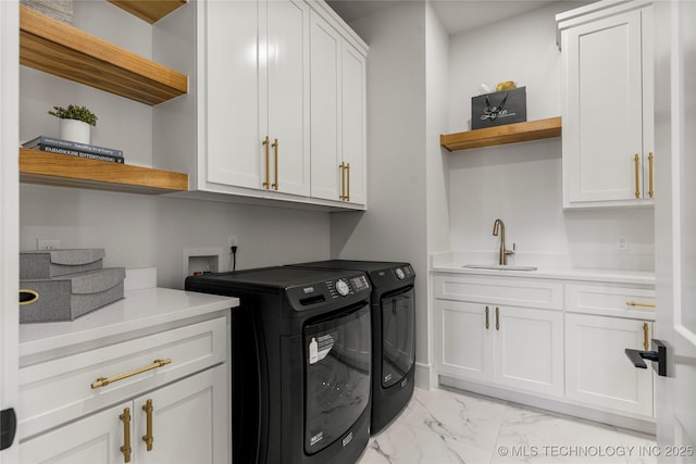 laundry room featuring cabinet space, a sink, marble finish floor, indoor wet bar, and washer and clothes dryer