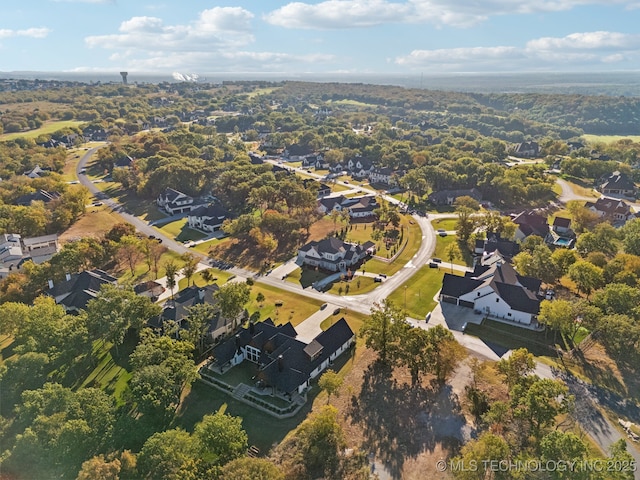 birds eye view of property with a residential view
