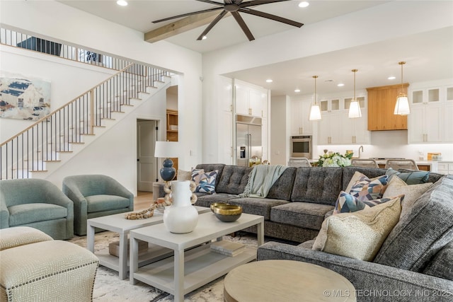 living room featuring recessed lighting, a ceiling fan, and stairway