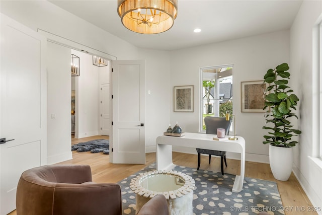 office area featuring recessed lighting, baseboards, an inviting chandelier, and light wood-style flooring