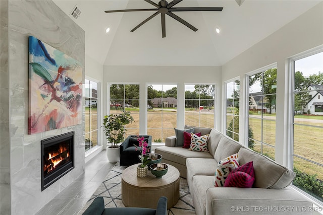 sunroom featuring recessed lighting, high vaulted ceiling, visible vents, and tile patterned flooring