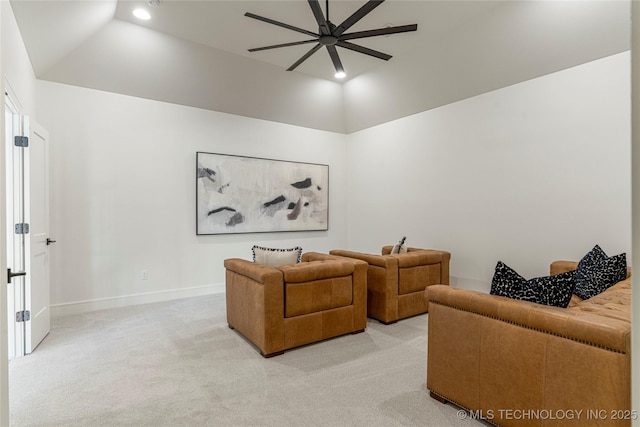 living room with ceiling fan, light colored carpet, baseboards, and lofted ceiling