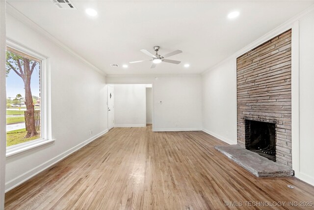 4814 E 37th St, Tulsa, OK 74135 - unfurnished living room with visible vents, a fireplace, light wood-style floors, baseboards, and ceiling fan