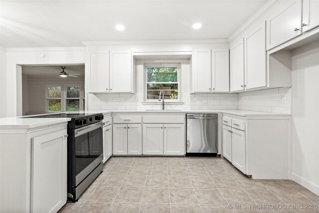 4814 E 37th St, Tulsa, OK 74135 - kitchen with stainless steel dishwasher, decorative backsplash, crown molding, range with electric stovetop, and a sink