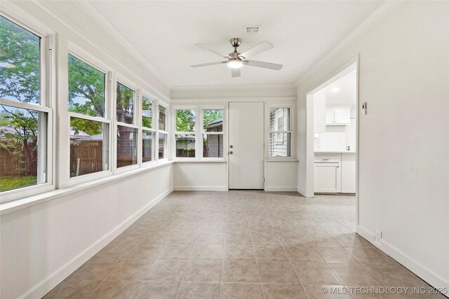 4814 E 37th St, Tulsa, OK 74135 - unfurnished sunroom featuring crown molding, baseboards, tile patterned flooring, and visible vents