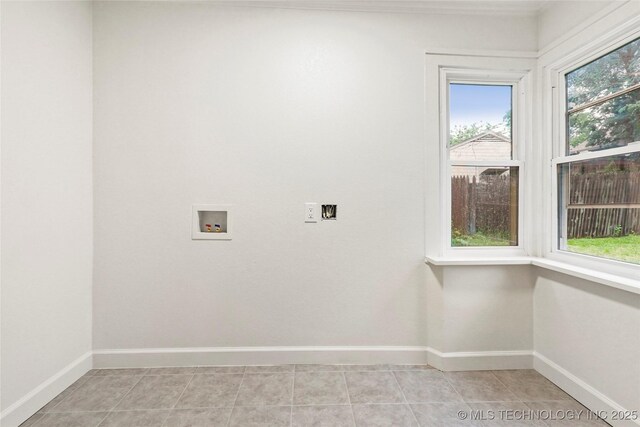 4814 E 37th St, Tulsa, OK 74135 - laundry room featuring washer hookup, light tile patterned floors, laundry area, and baseboards