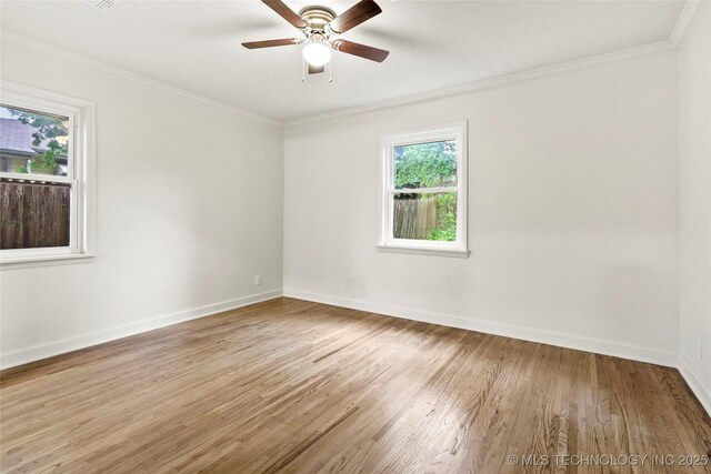 4814 E 37th St, Tulsa, OK 74135 - spare room featuring baseboards, a ceiling fan, crown molding, and wood finished floors