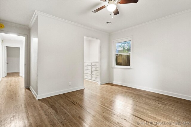 4814 E 37th St, Tulsa, OK 74135 - unfurnished room with a ceiling fan, visible vents, wood finished floors, baseboards, and ornamental molding