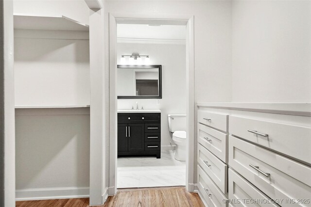 4814 E 37th St, Tulsa, OK 74135 - bathroom featuring toilet, baseboards, marble finish floor, and vanity