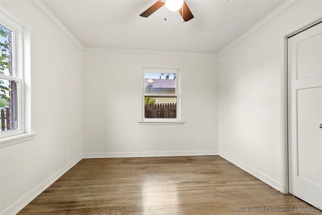 4814 E 37th St, Tulsa, OK 74135 - spare room featuring crown molding, baseboards, ceiling fan, and wood finished floors