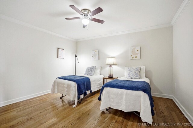4814 E 37th St, Tulsa, OK 74135 - bedroom featuring crown molding, wood-type flooring, baseboards, and ceiling fan