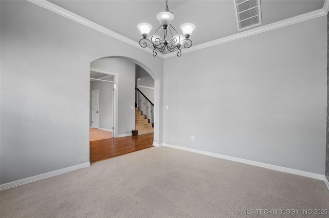 9502 S 73rd E Ave, Tulsa, OK 74133 - spare room with visible vents, crown molding, arched walkways, a notable chandelier, and carpet flooring