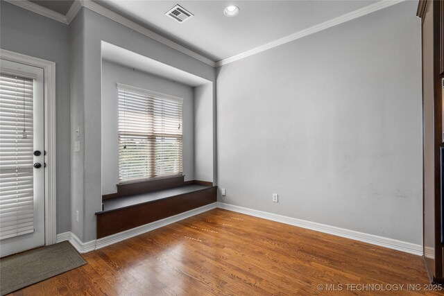 9502 S 73rd E Ave, Tulsa, OK 74133 - empty room featuring crown molding, baseboards, visible vents, and wood finished floors