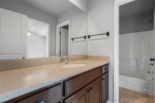 9502 S 73rd E Ave, Tulsa, OK 74133 - full bathroom with vanity, tile patterned floors, and shower / washtub combination