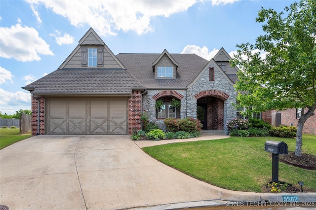 9502 S 73rd E Ave, Tulsa, OK 74133 - craftsman house with a shingled roof, a front lawn, stone siding, brick siding, and driveway