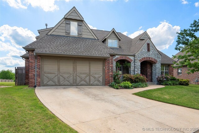 9502 S 73rd E Ave, Tulsa, OK 74133 - view of front of house with concrete driveway, brick siding, a shingled roof, and a front yard