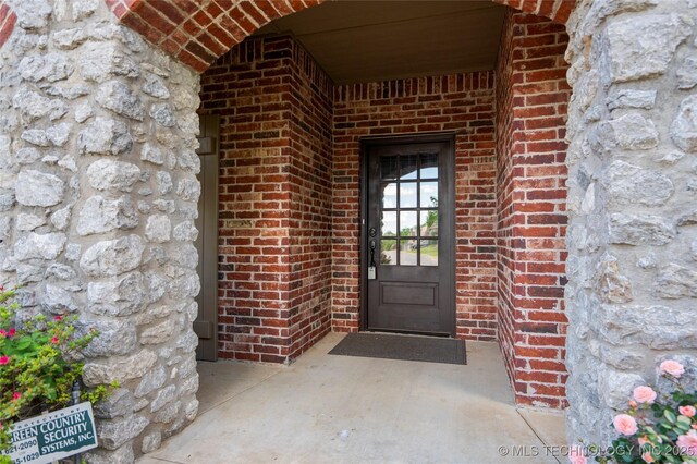 9502 S 73rd E Ave, Tulsa, OK 74133 - view of exterior entry with brick siding and stone siding